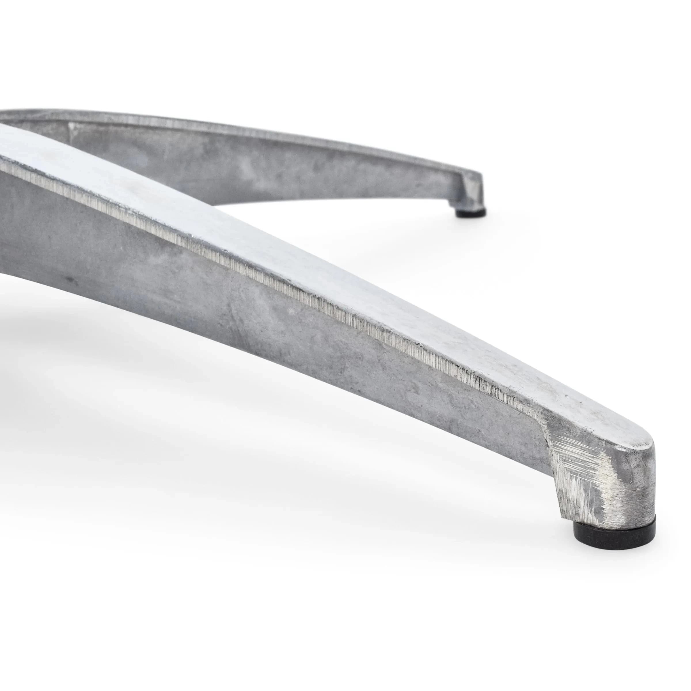 Close view of two steel feet on the 24-inch cocktail table base showing grip and support structure.