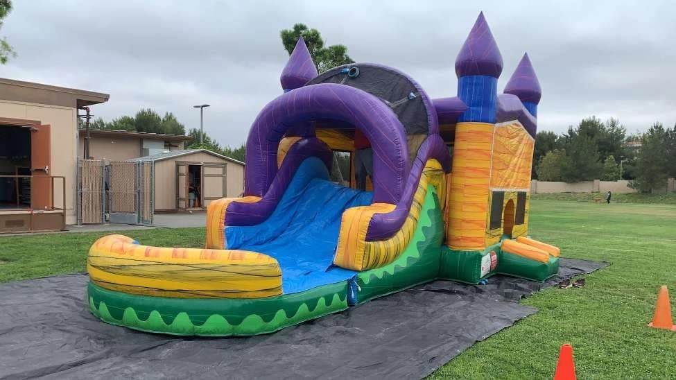 Outdoor front angle of the 5 in 1 Water Fun Castle Combo set up for an event.