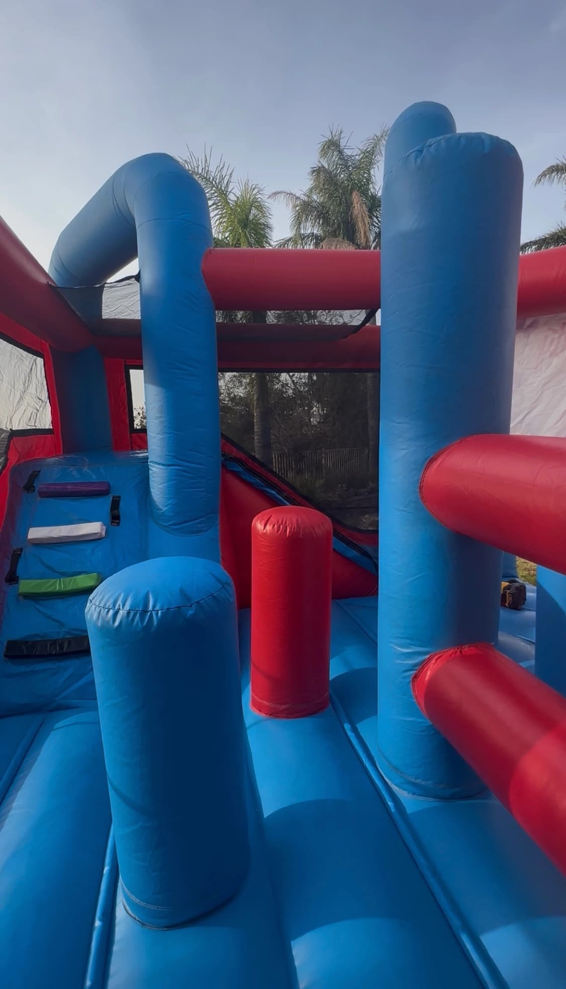 Interior view of the Disney Mickey Mouse 5-in-1 combo showing bounce space, climb wall, and slide entrance.