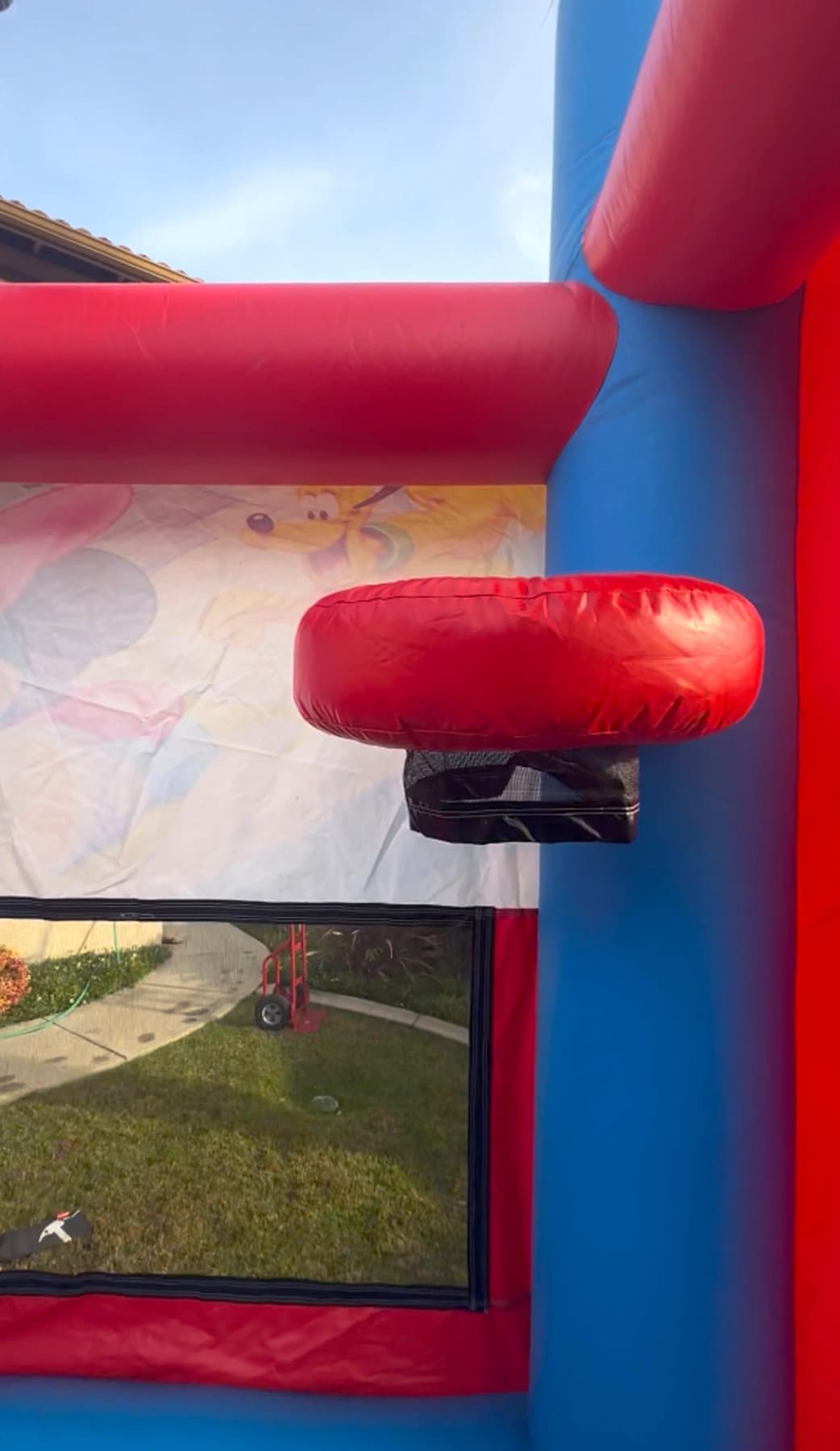 Basketball hoop feature inside the Disney Minnie Mouse 5-in-1 combo bounce house.