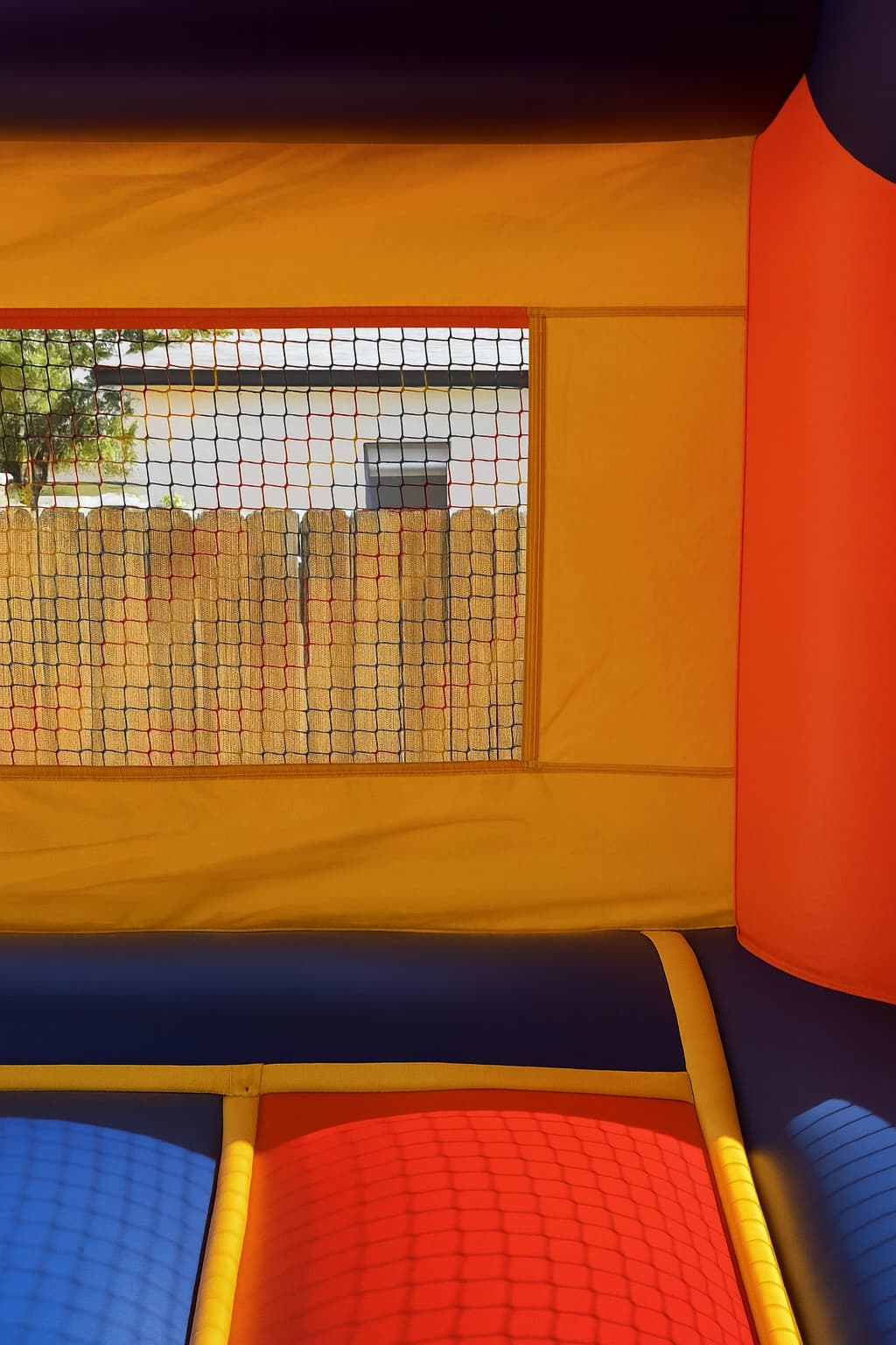Interior view of the Jumpland Castle bounce house showing open jump area and padded floor sections.
