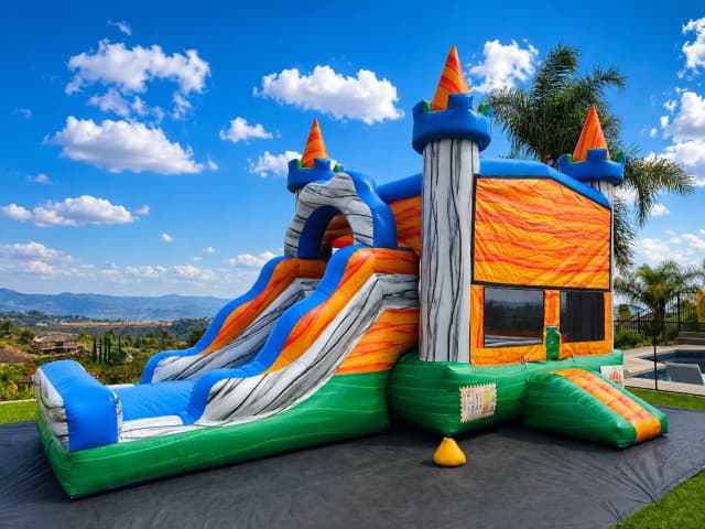 Front view of the Jurassic Adventure 4-in-1 Combo showing dinosaur graphics, slide, and climbing wall.
