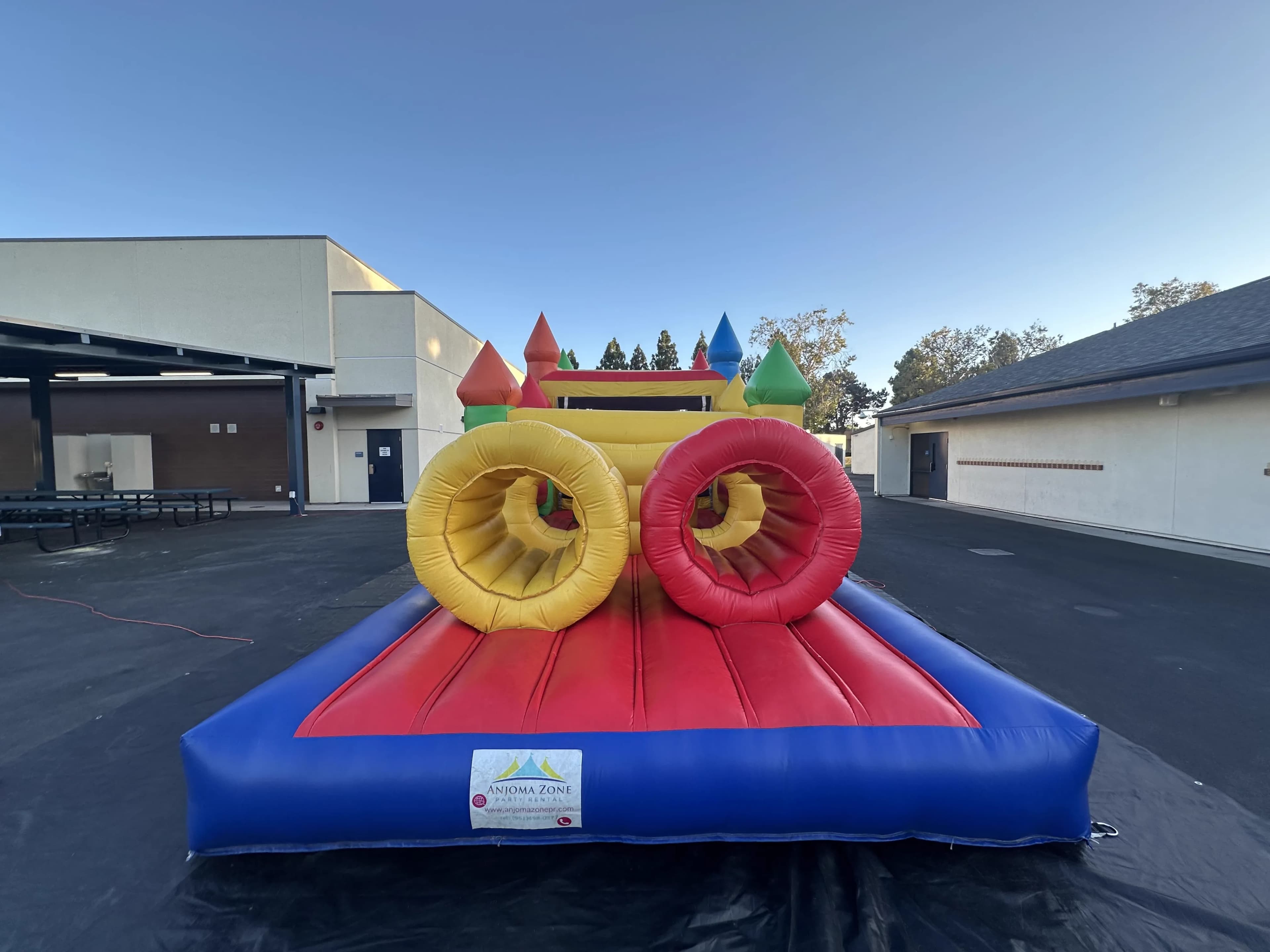 Rear view of the Super 6 in 2 Fun Run Obstacle Combo showing the back section of the obstacle course with slide exit area.