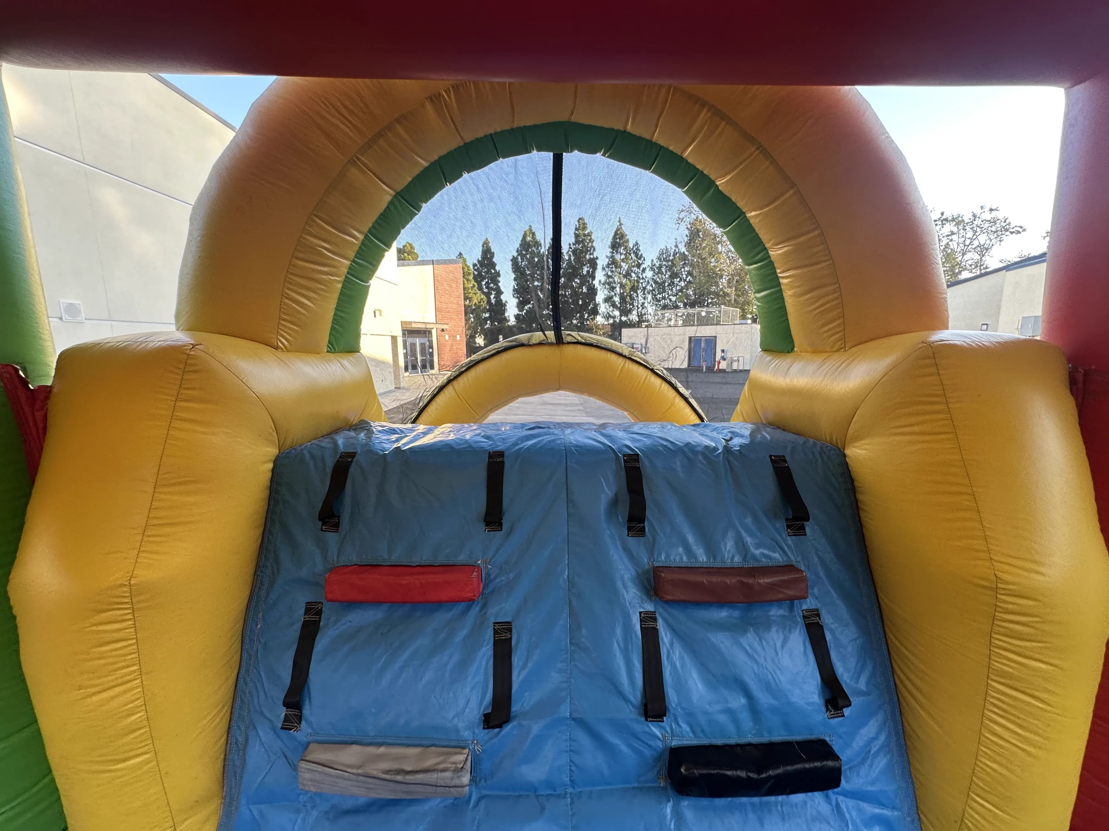 Interior entry point view of the Super 6 in 2 Fun Run Obstacle Combo showing the entrance area from inside the course.
