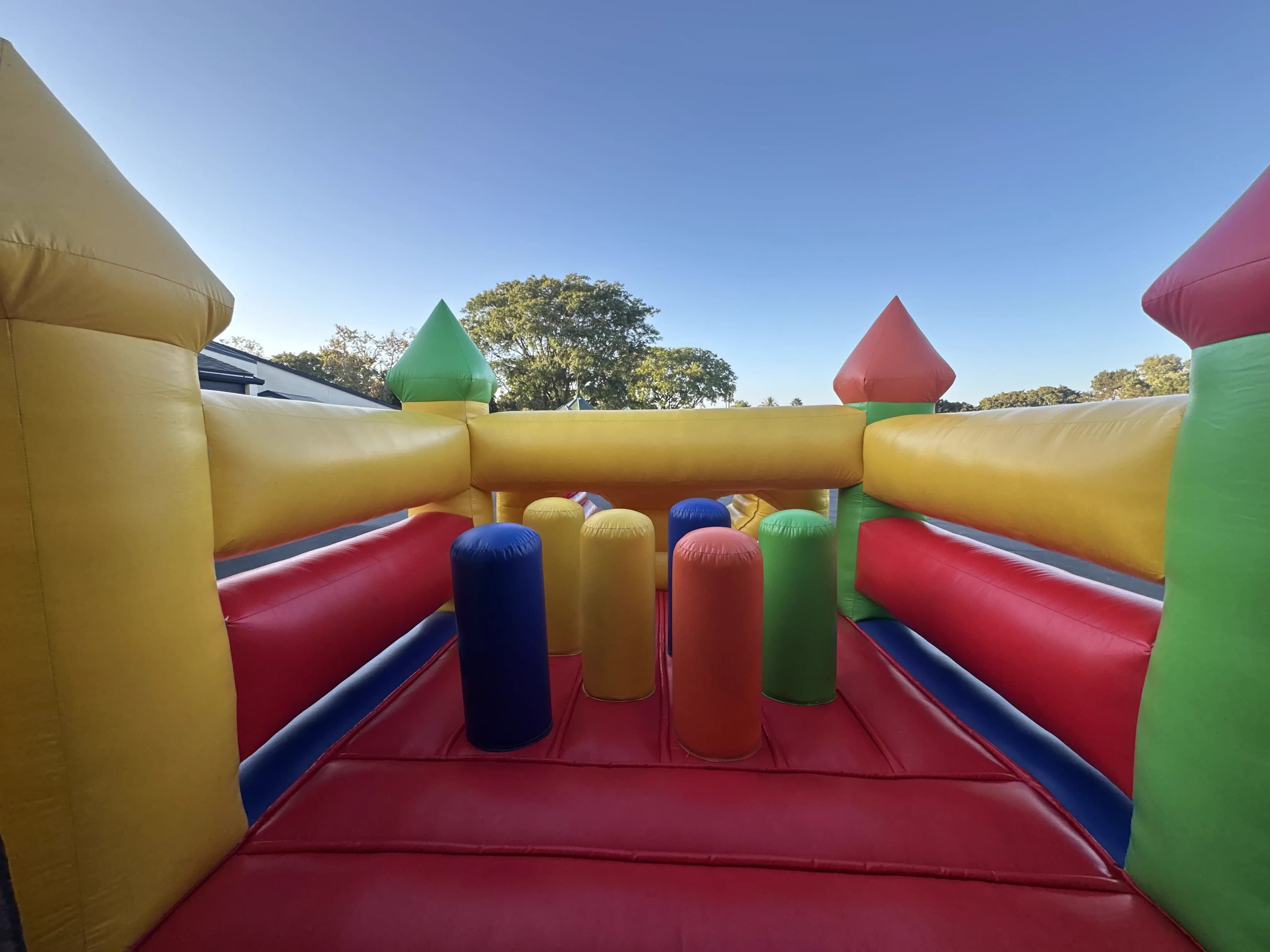 Spacious interior play zone of the Super 6 in 2 Fun Run Obstacle Combo featuring the basketball hoop, bounce floor, and connecting pathways between obstacles.