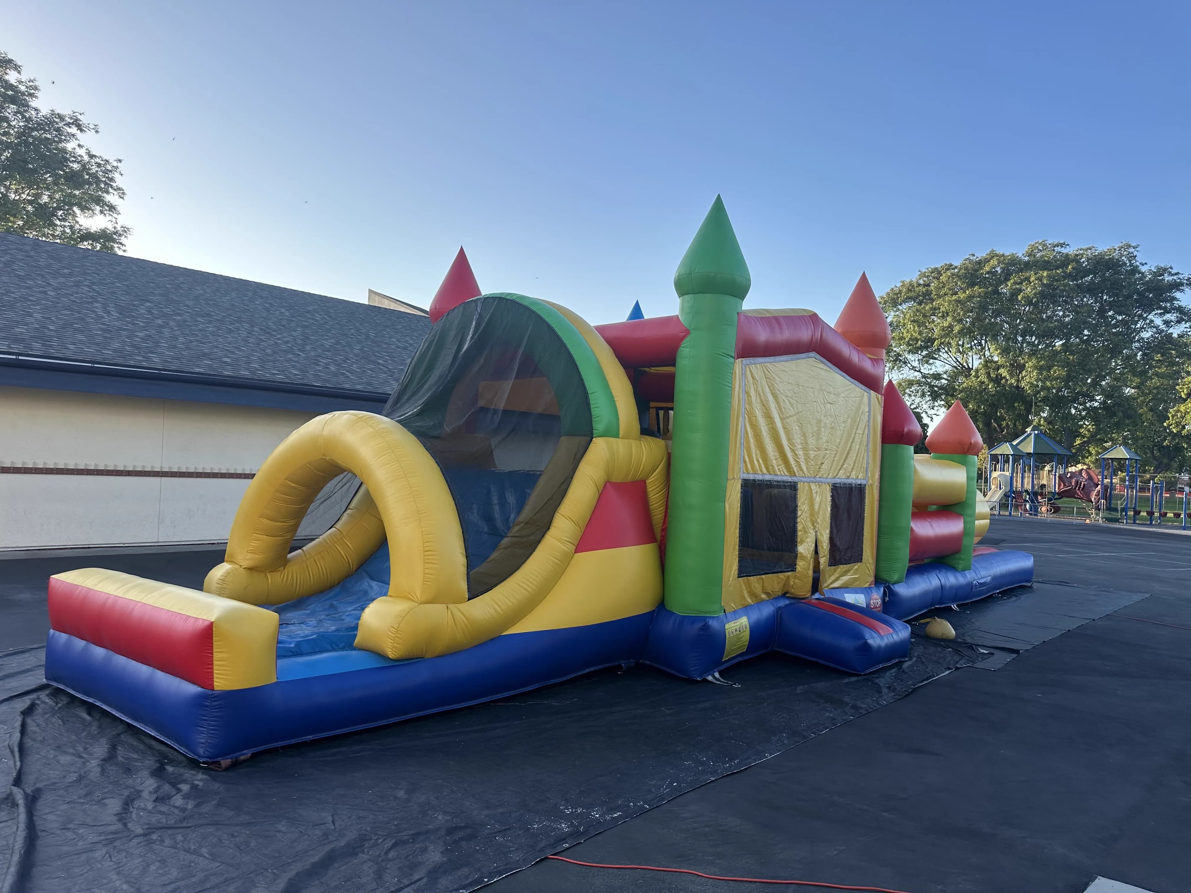 Front-side angle of the Super 6 in 2 Fun Run Obstacle Combo showing the course entry, climbing obstacles, and slide exit.
