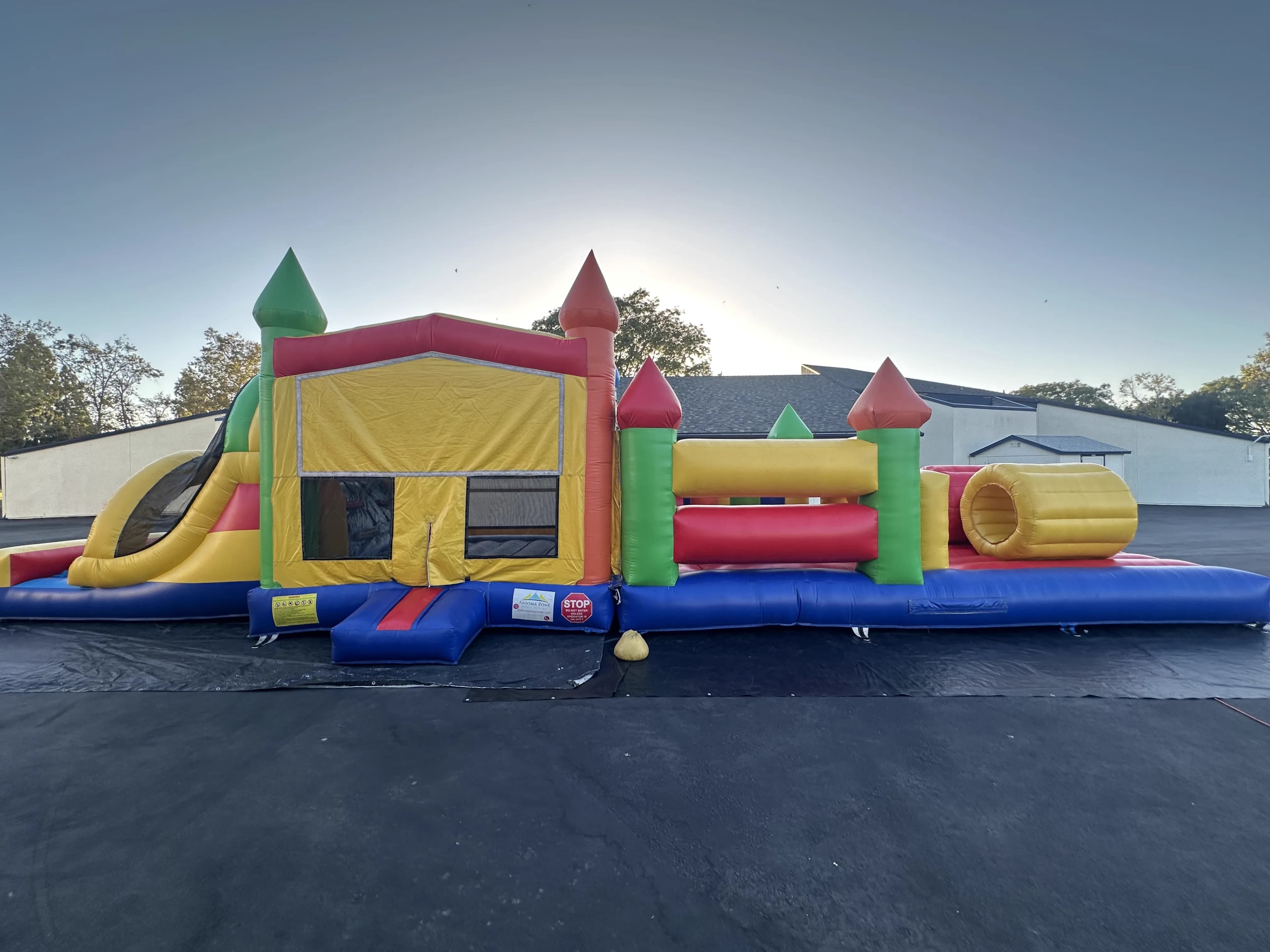 Side view of the Super 6 in 2 Fun Run Obstacle Combo showing the full obstacle course layout with climbing elements and slide.