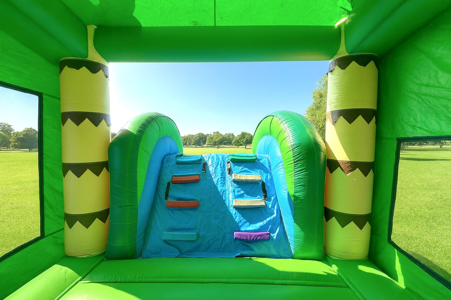 Interior climb view of the Tropical Palm 5-in-1 Water Combo showing steps leading to the slide platform.