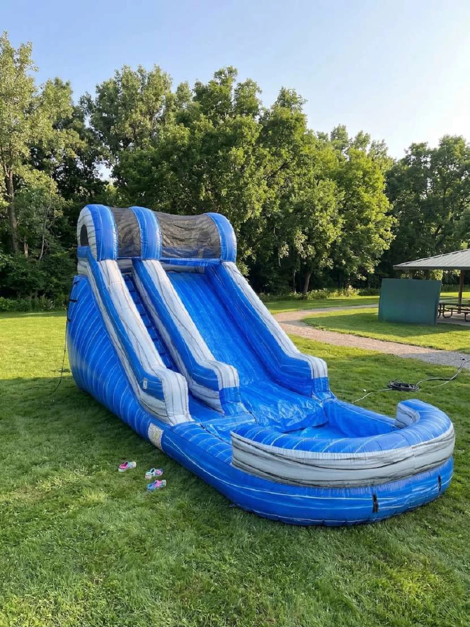 Front hero view of the Wild Blue Tropical Splash Water Slide showing main features and design.